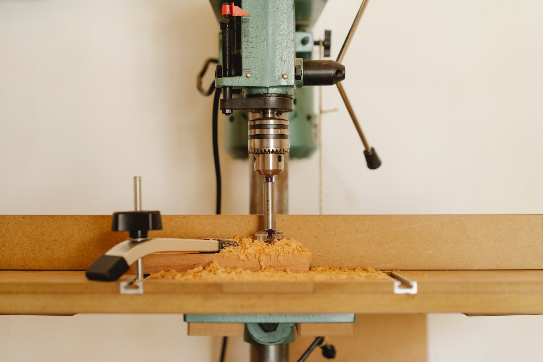 modern drill press in light workshop