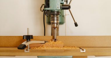 modern drill press in light workshop